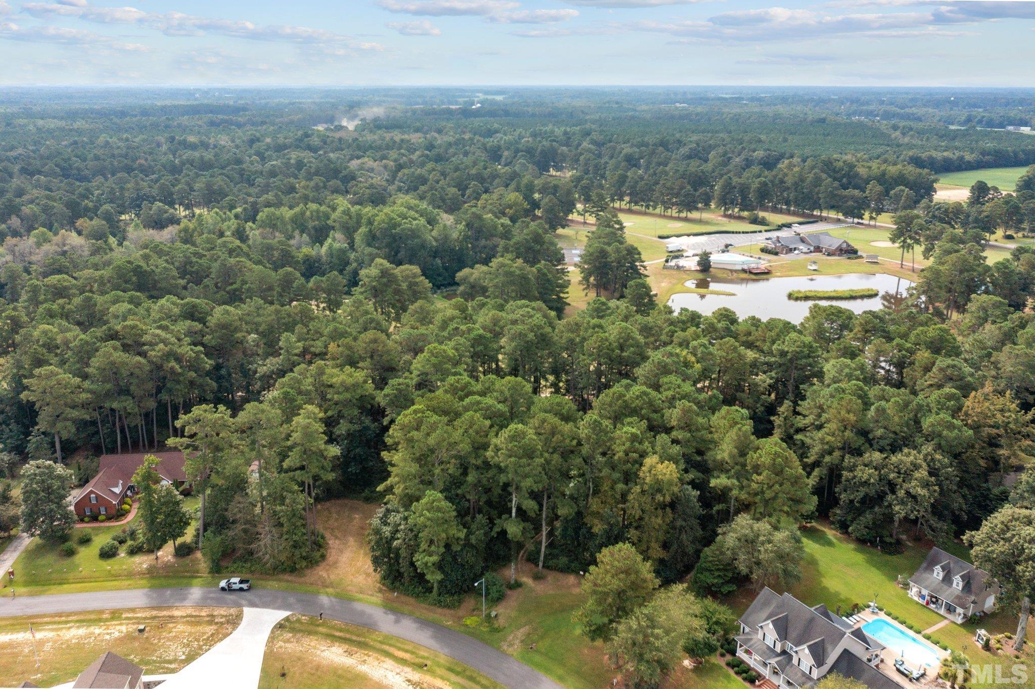 84 Golf Course Drive Pinetops, NC 27864 - Photo 2 of 38 an aerial view of residential houses with outdoor space