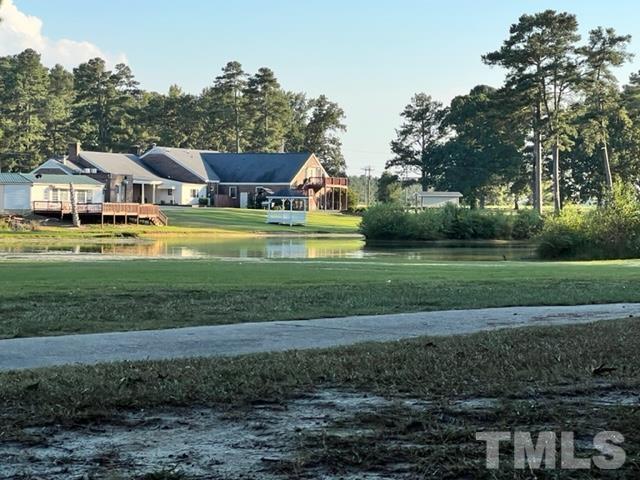 84 Golf Course Drive Pinetops, NC 27864 - Photo 35 of 38 a front view of a house with a yard