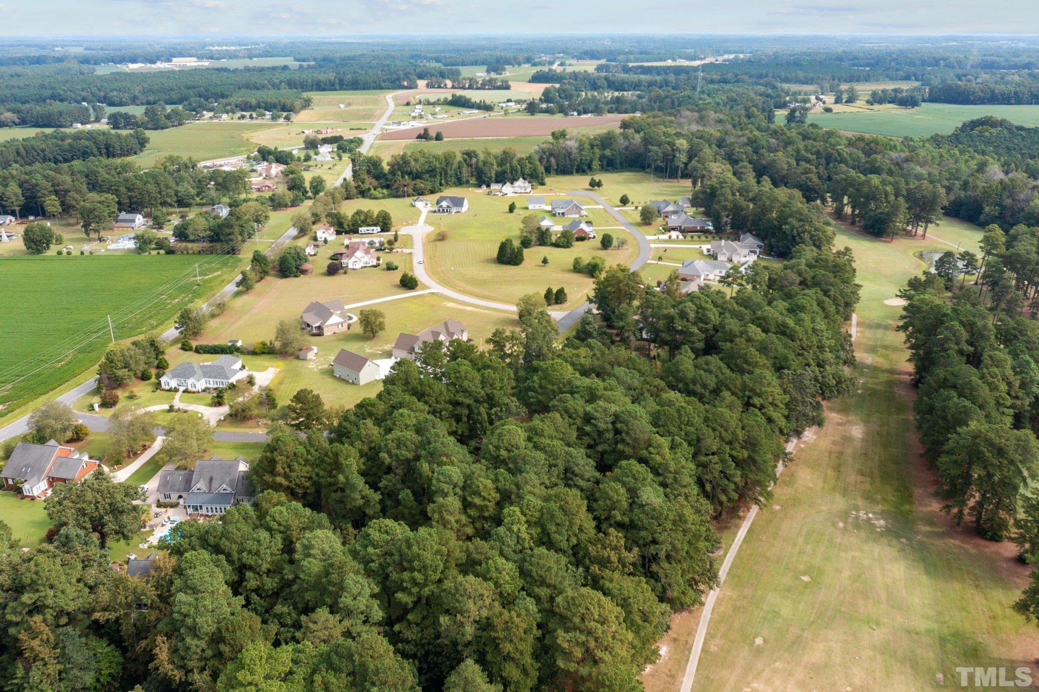 84 Golf Course Drive Pinetops, NC 27864 - Photo 5 of 38 an aerial view of a city with lots of residential buildings