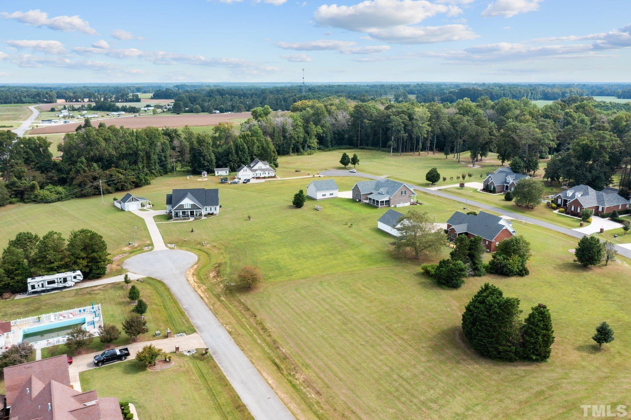 84 Golf Course Drive Pinetops, NC 27864 - Photo 9 of 38 a view of a swimming pool and lounge chair