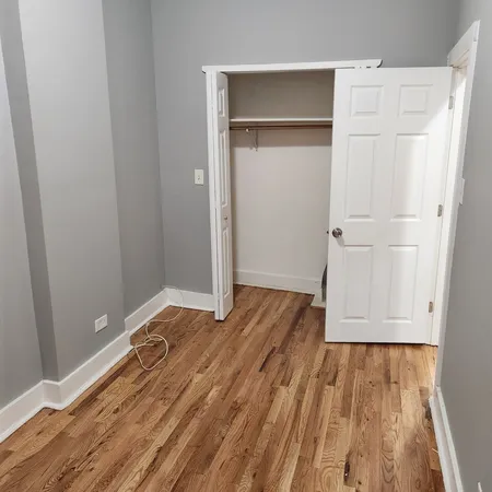 a view of room with wooden floor