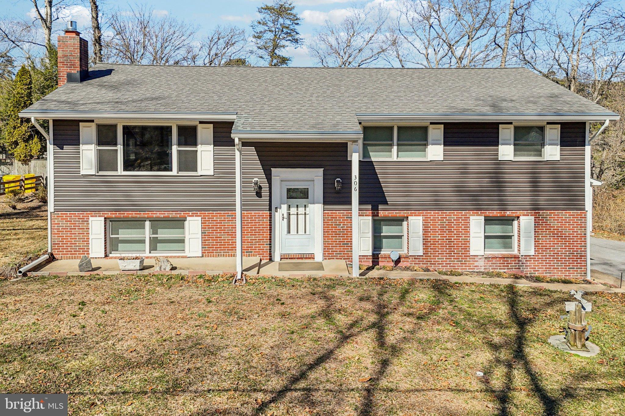 306 Christy Road Pasadena, MD 21122 - Photo 1 of 58 a front view of a house with a yard
