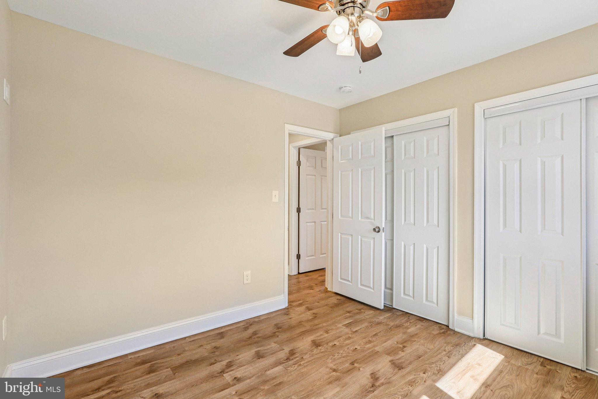 306 Christy Road Pasadena, MD 21122 - Photo 14 of 58 a view of an empty room with wooden floor