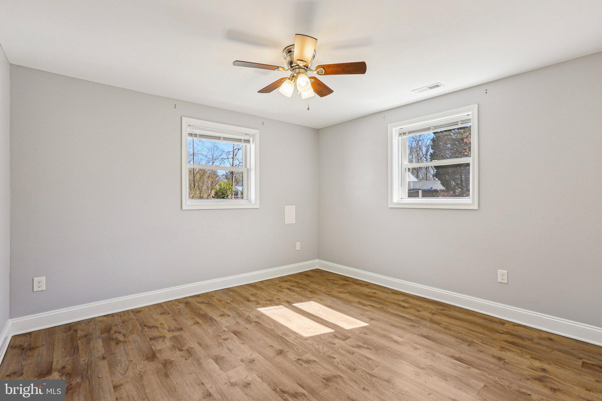 306 Christy Road Pasadena, MD 21122 - Photo 15 of 58 a view of empty room with wooden floor
