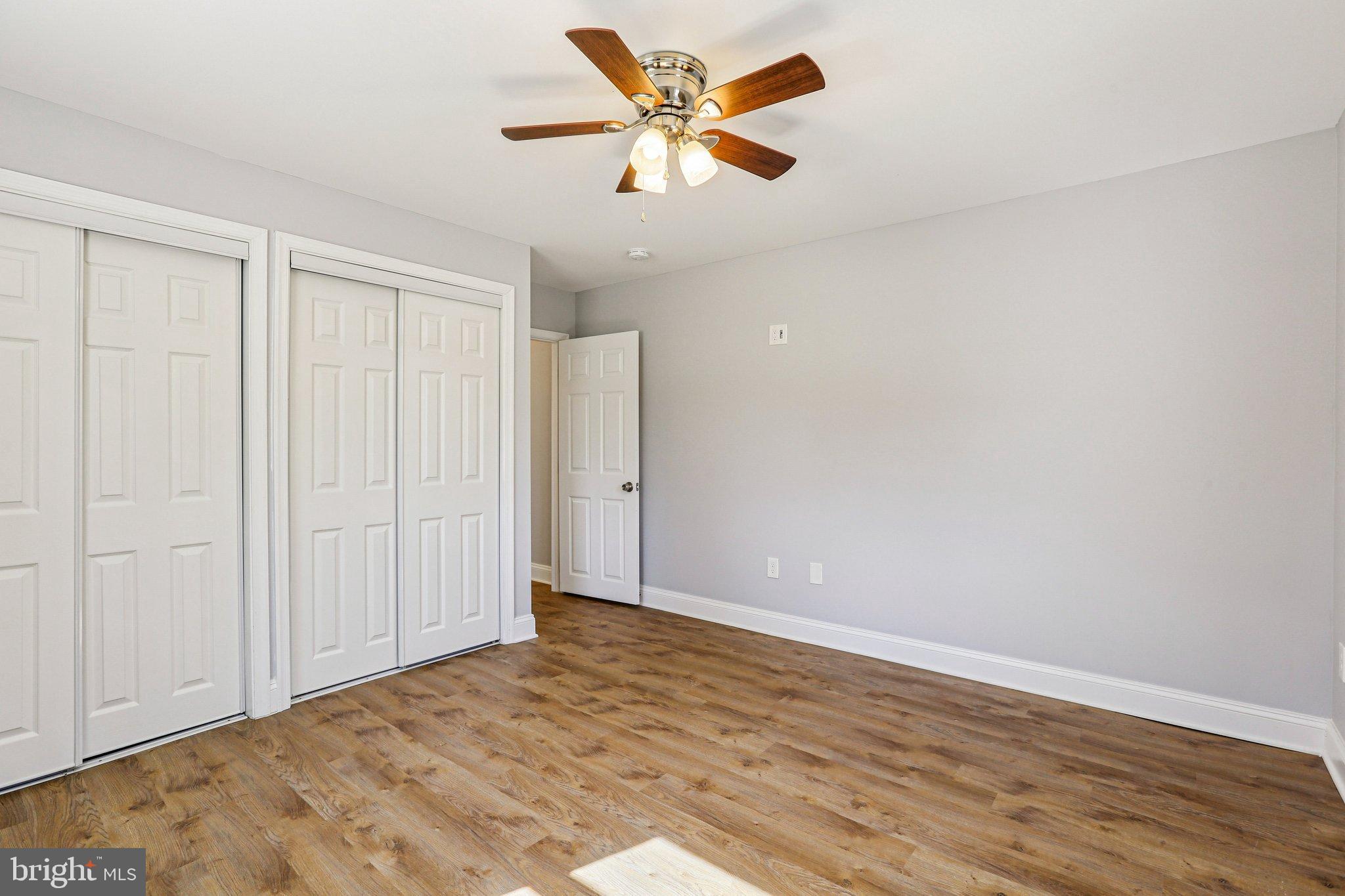 306 Christy Road Pasadena, MD 21122 - Photo 16 of 58 Bright and airy bedroom with modern charm.