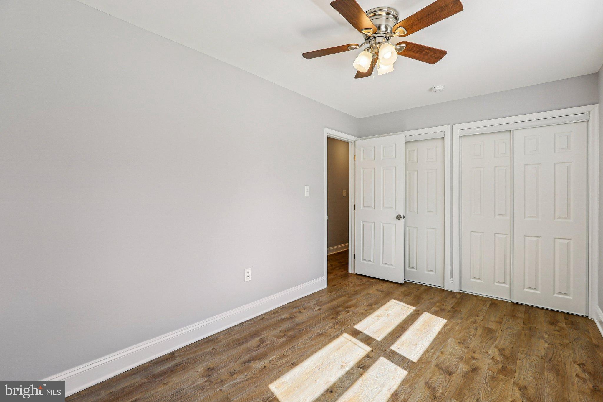 306 Christy Road Pasadena, MD 21122 - Photo 20 of 58 a view of a livingroom with a chandelier fan