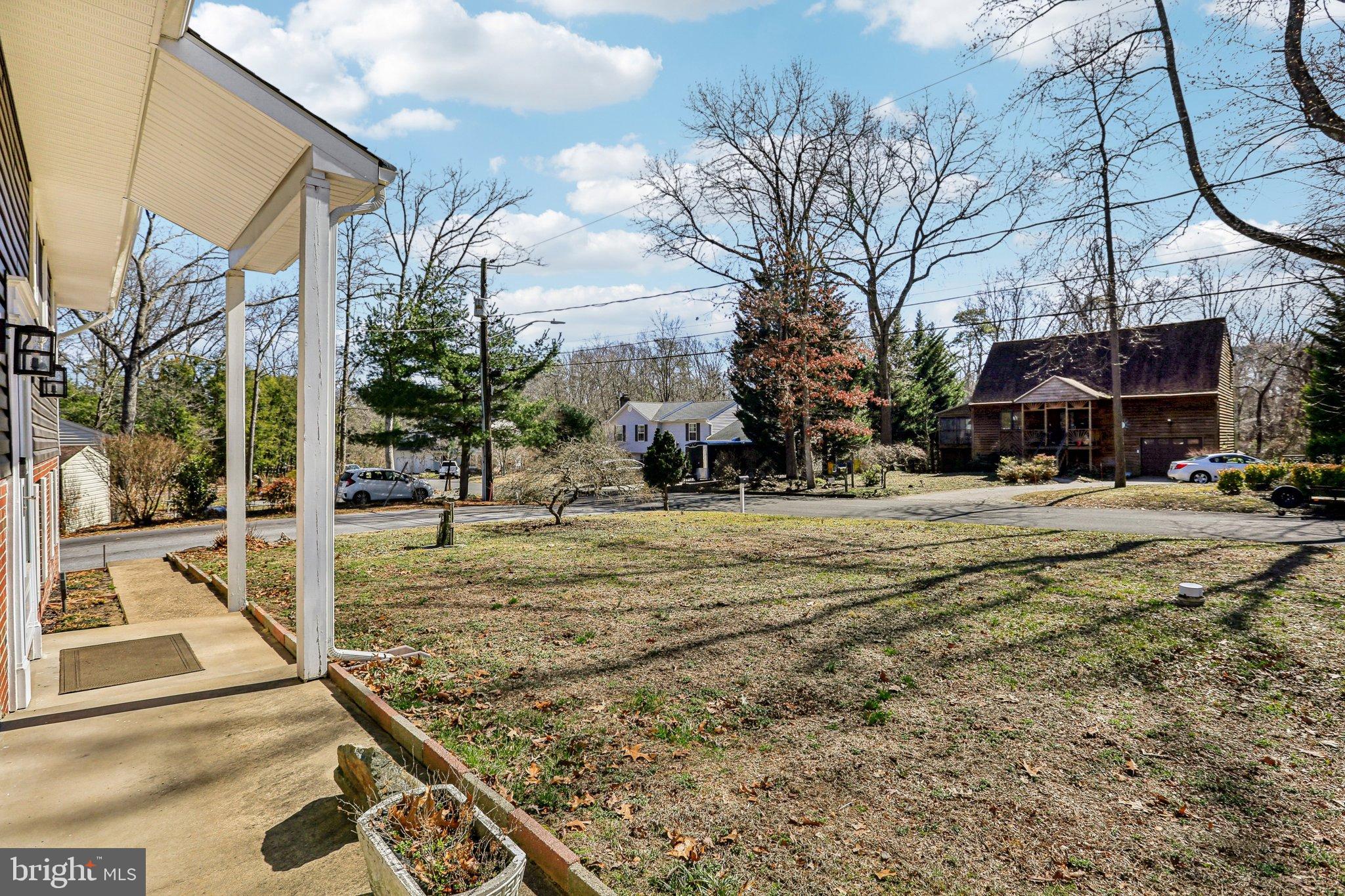 306 Christy Road Pasadena, MD 21122 - Photo 2 of 58 a view of a building with a snow on the road