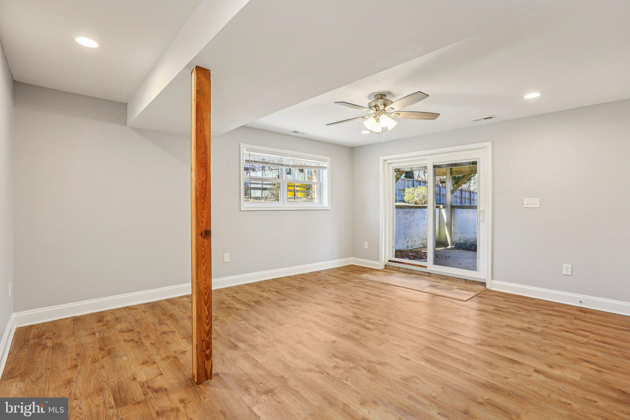 306 Christy Road Pasadena, MD 21122 - Photo 21 of 58 wooden floor in an empty room with a window