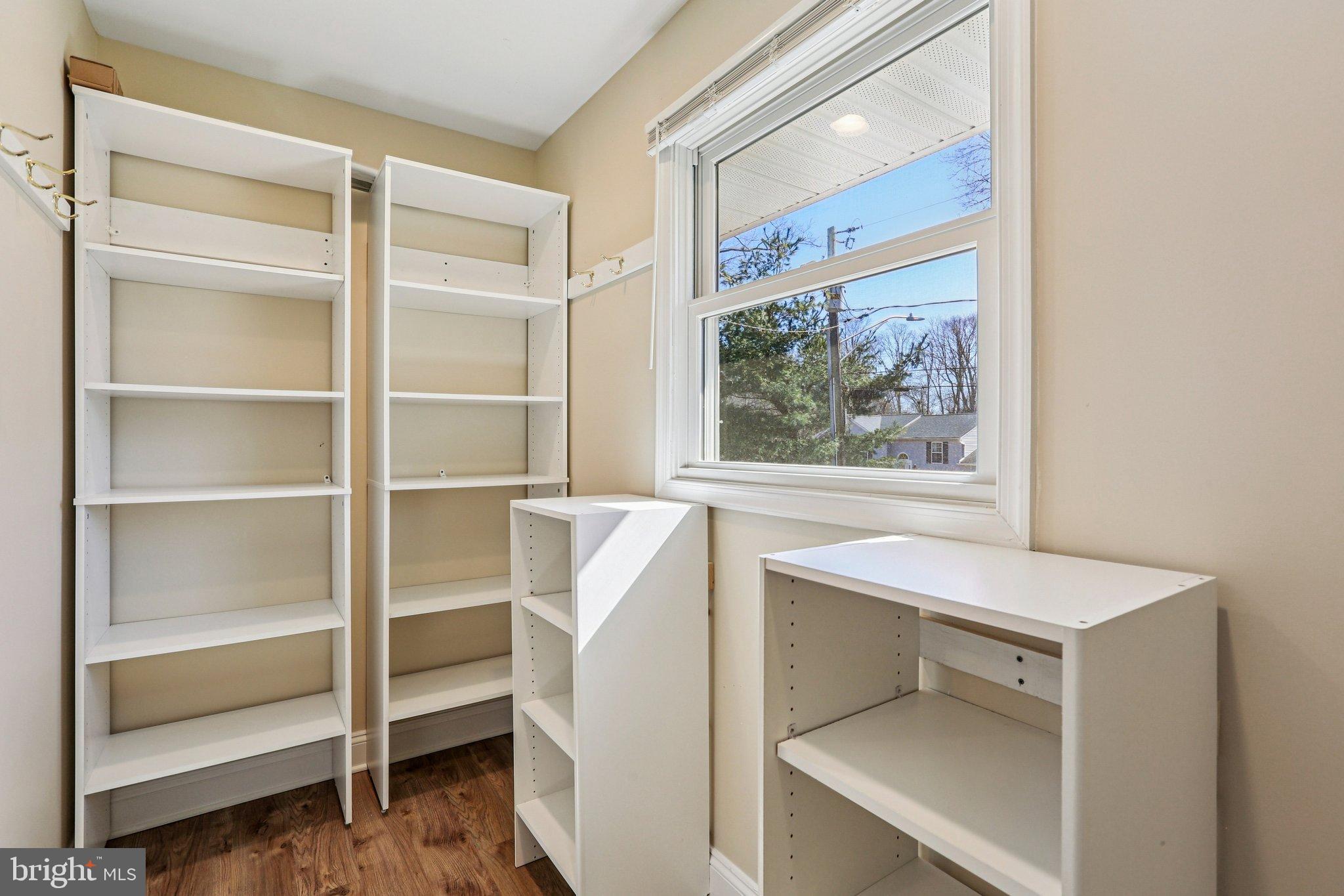 306 Christy Road Pasadena, MD 21122 - Photo 33 of 58 a view of walk in closet with empty racks