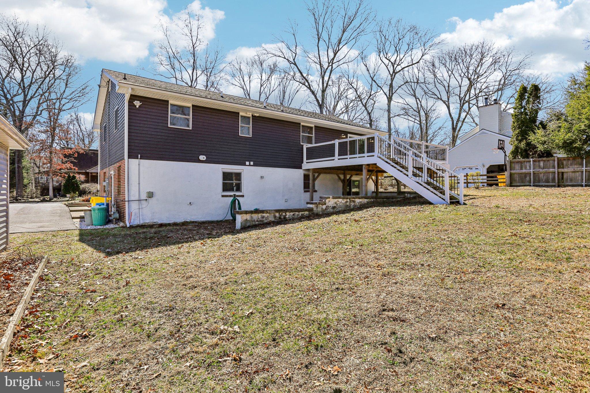 306 Christy Road Pasadena, MD 21122 - Photo 36 of 58 a front view of a house with a yard covered in snow