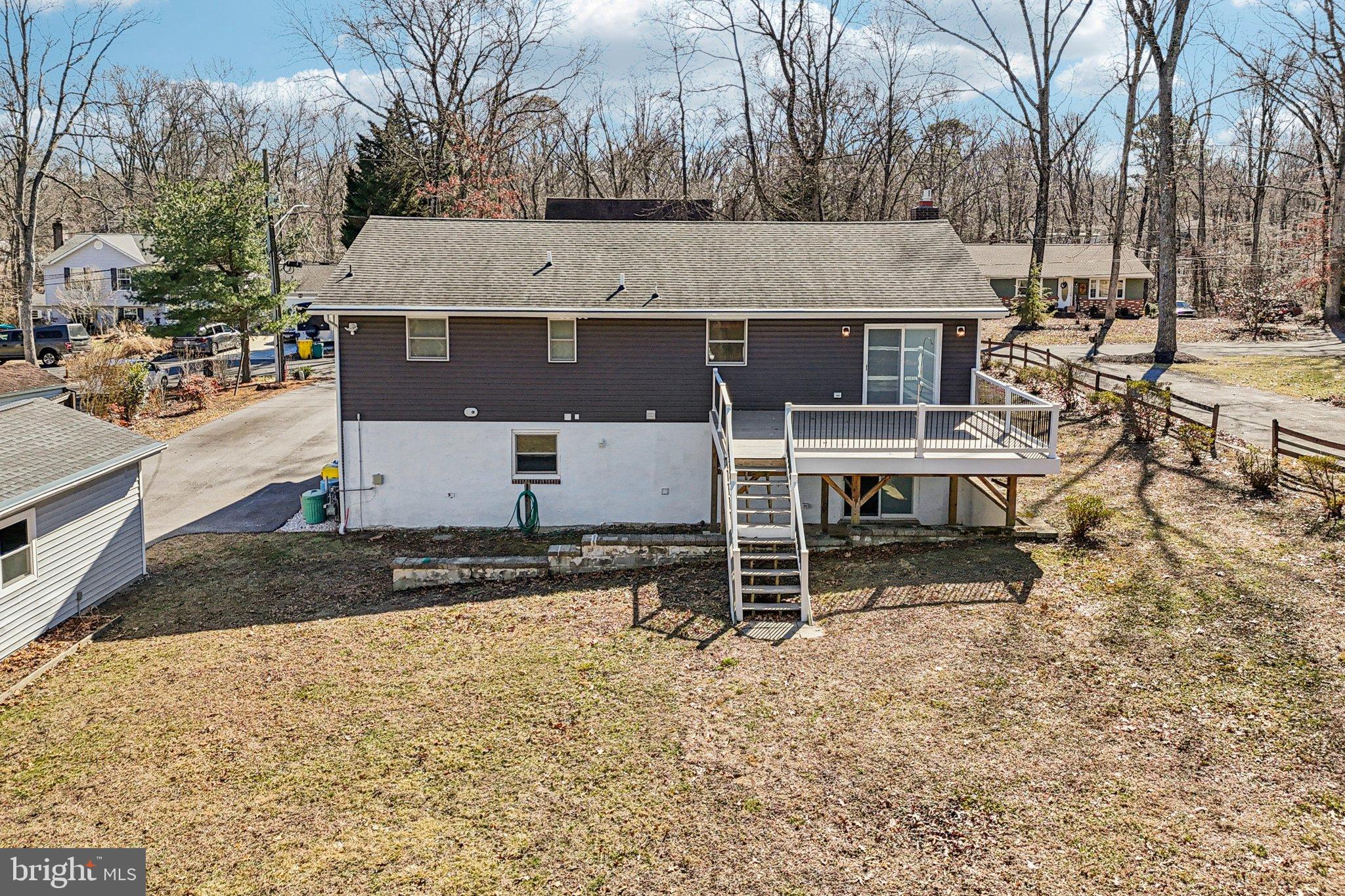 306 Christy Road Pasadena, MD 21122 - Photo 47 of 58 a view of a house with a yard and sitting area