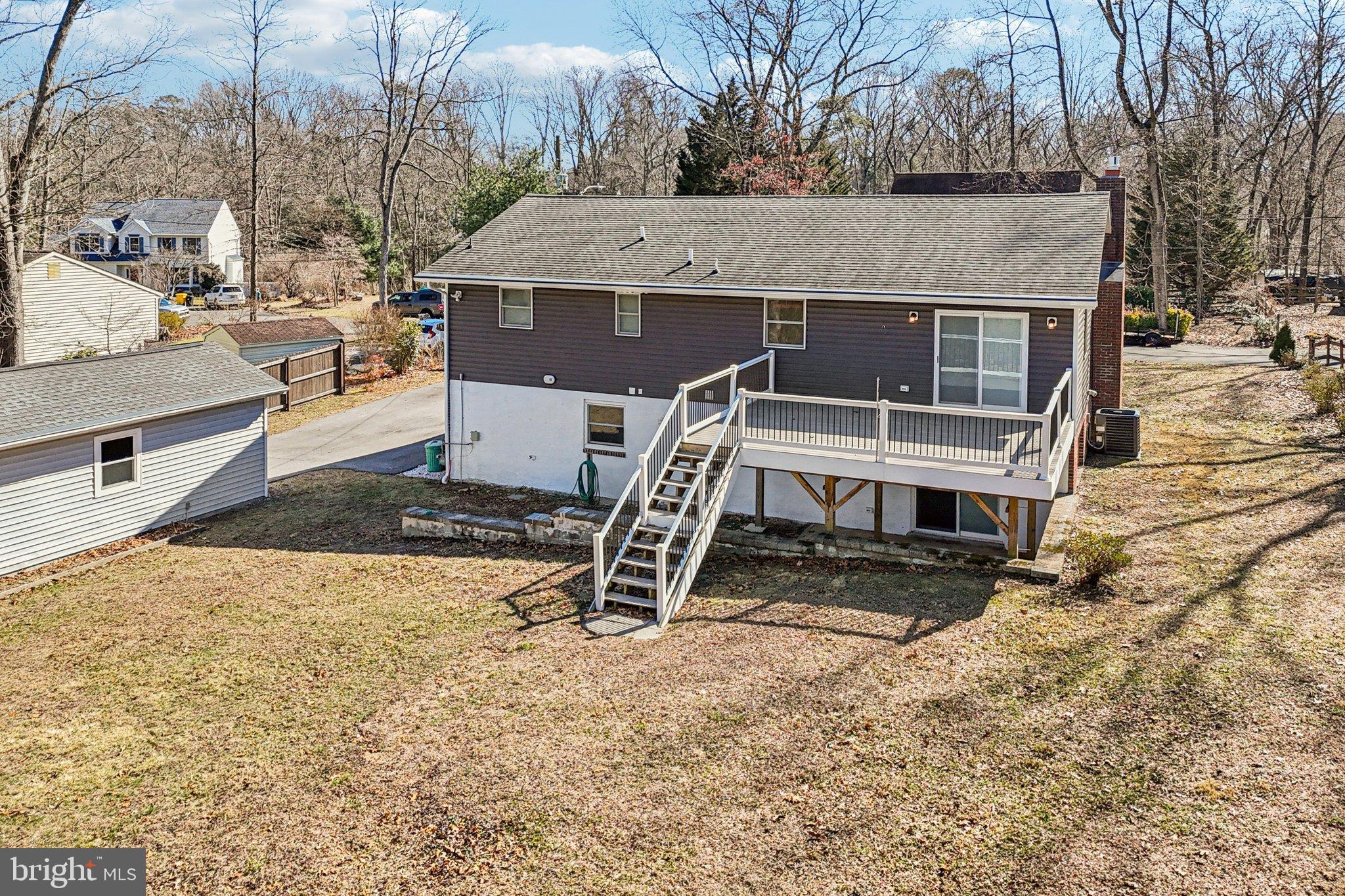 306 Christy Road Pasadena, MD 21122 - Photo 48 of 58 a view of a house with a snow on the road