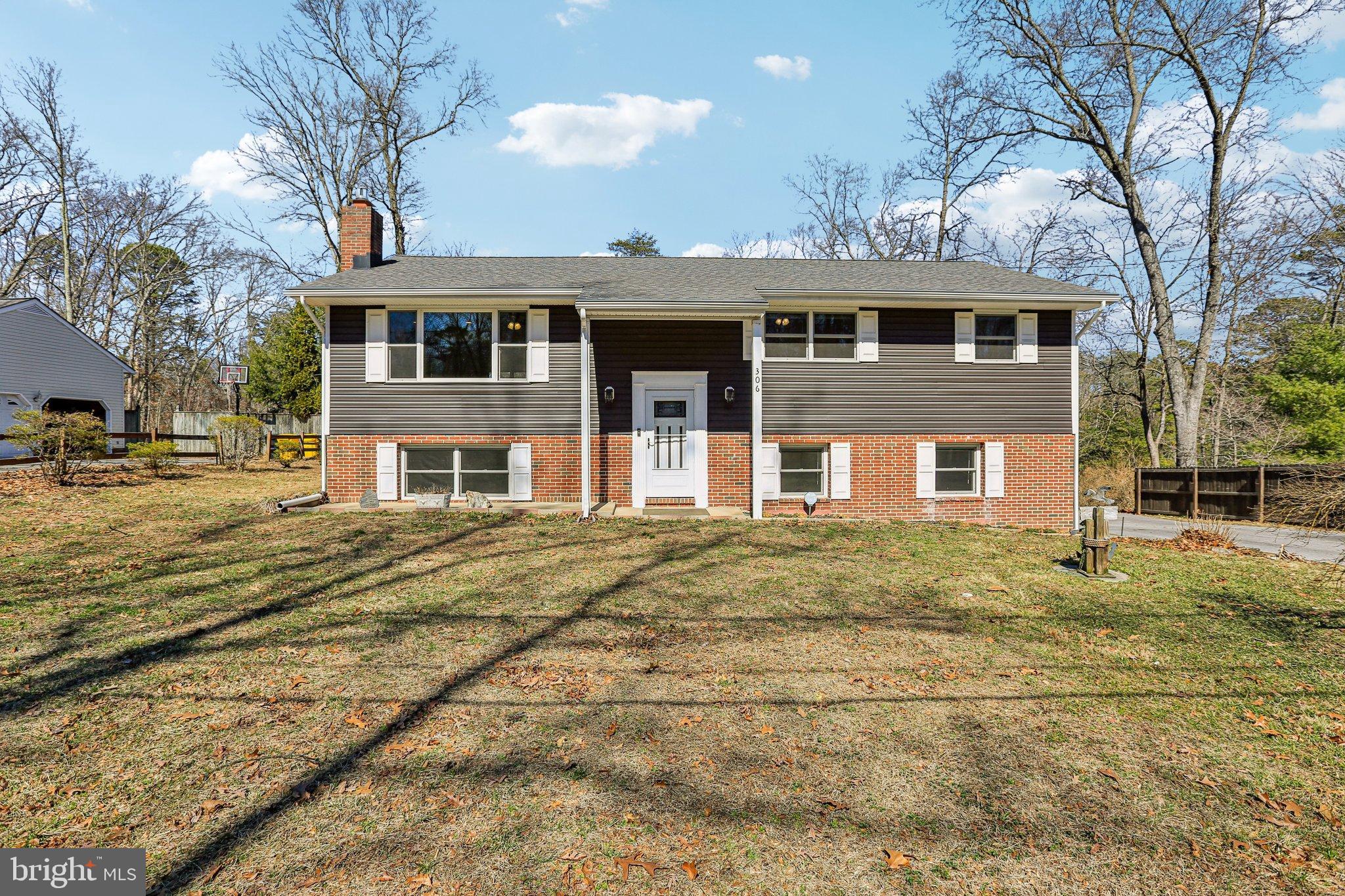 306 Christy Road Pasadena, MD 21122 - Photo 54 of 58 a front view of a house with a yard