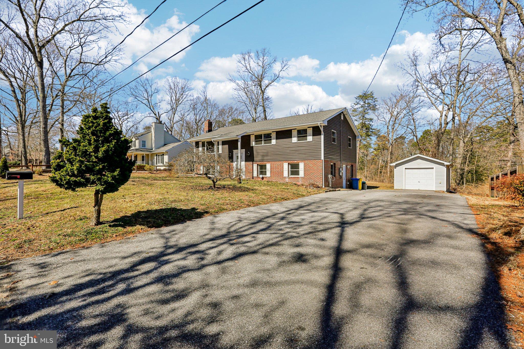 306 Christy Road Pasadena, MD 21122 - Photo 56 of 58 a view of a house with snow on the side of the road