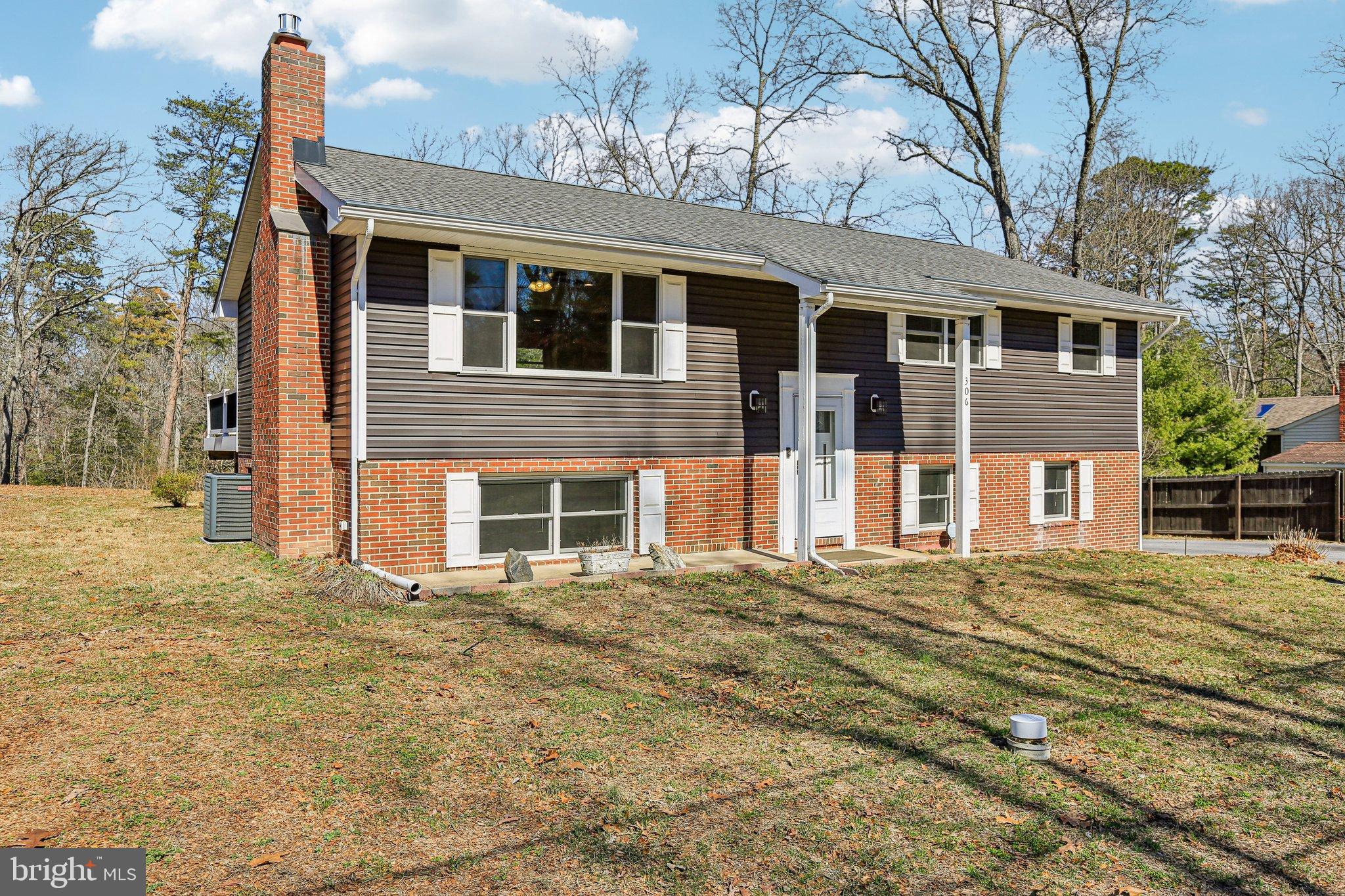 306 Christy Road Pasadena, MD 21122 - Photo 58 of 58 a front view of a house with a yard