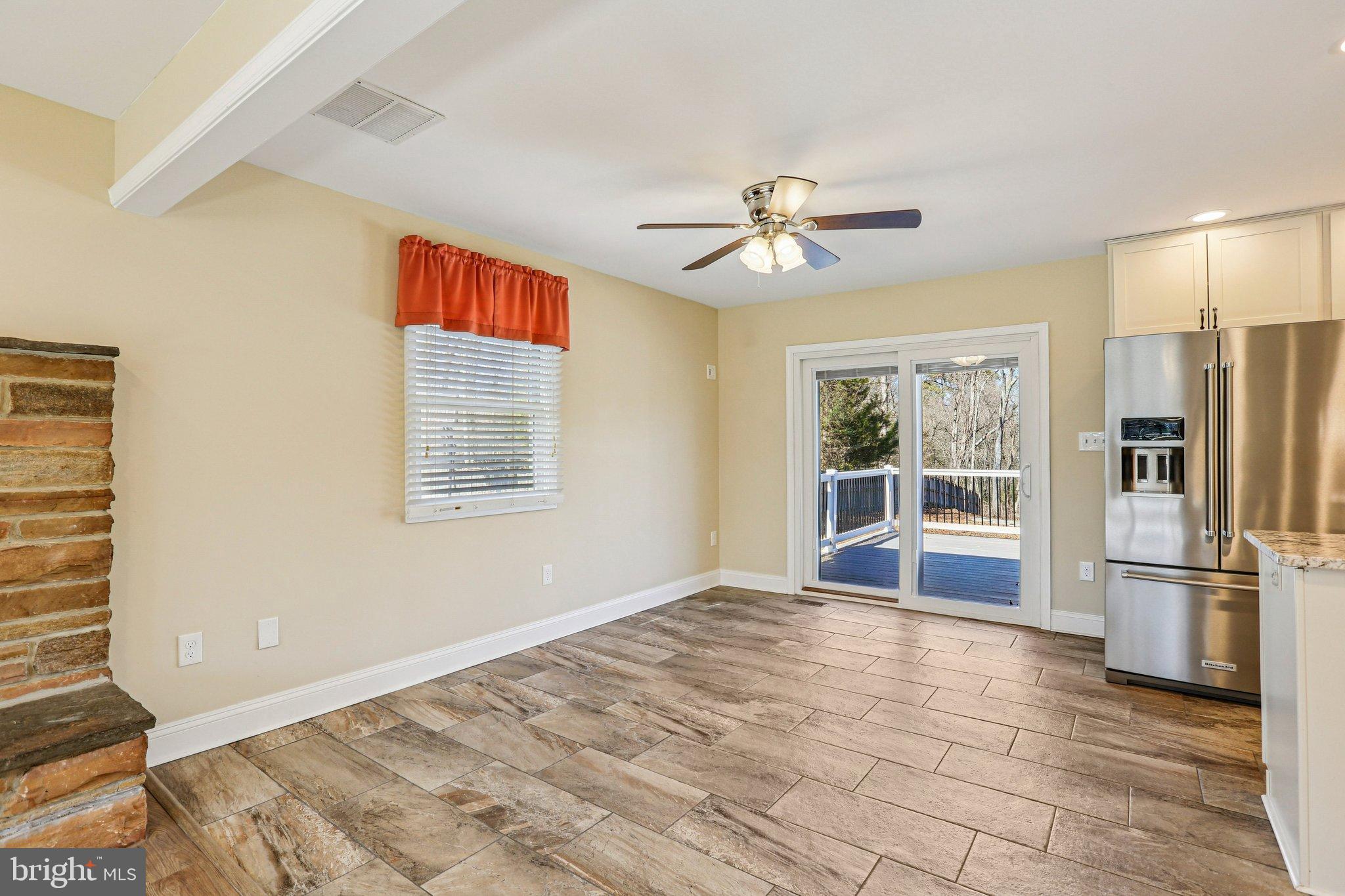 306 Christy Road Pasadena, MD 21122 - Photo 7 of 58 a view of an empty room with a window