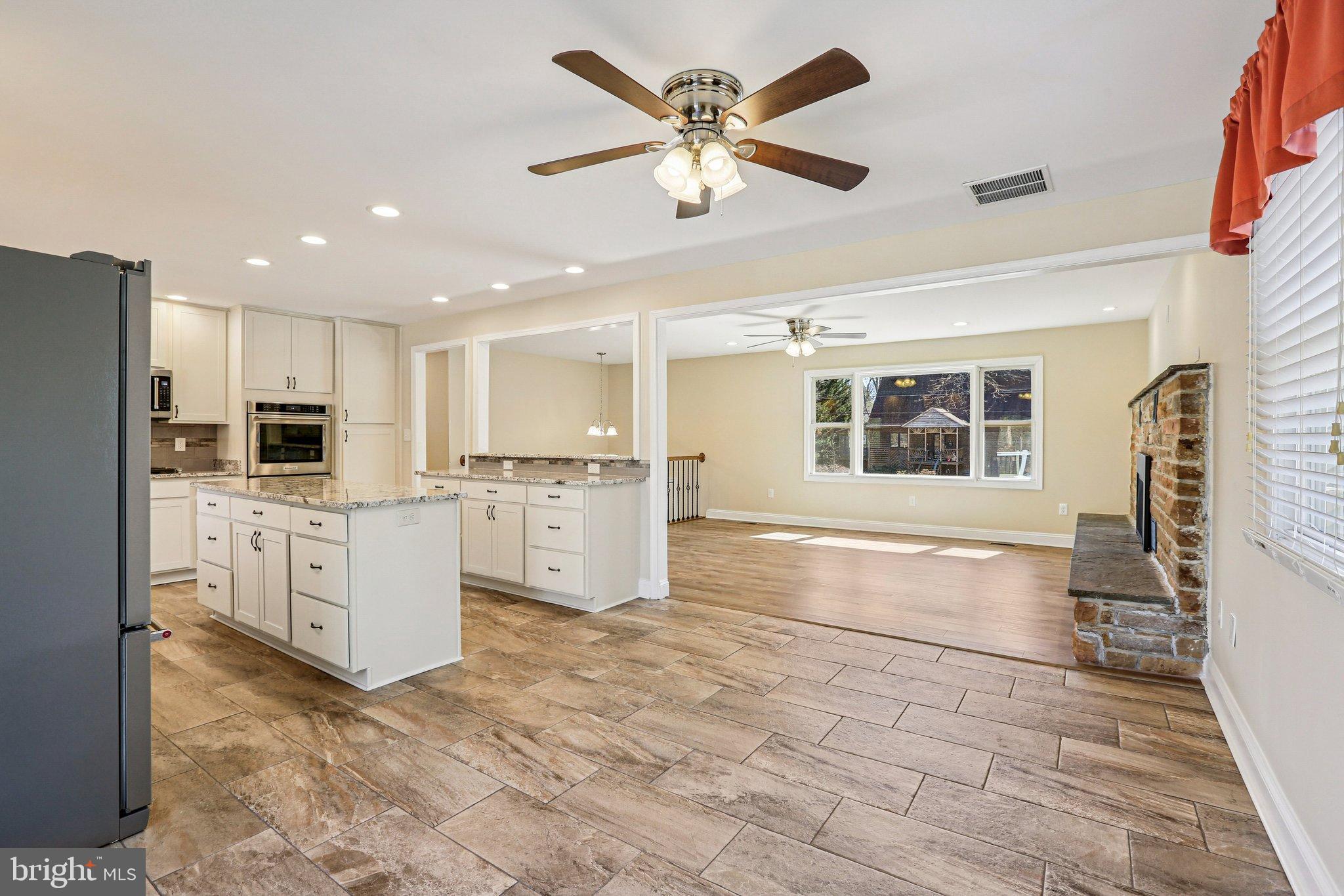 306 Christy Road Pasadena, MD 21122 - Photo 8 of 58 a large white kitchen with cabinets