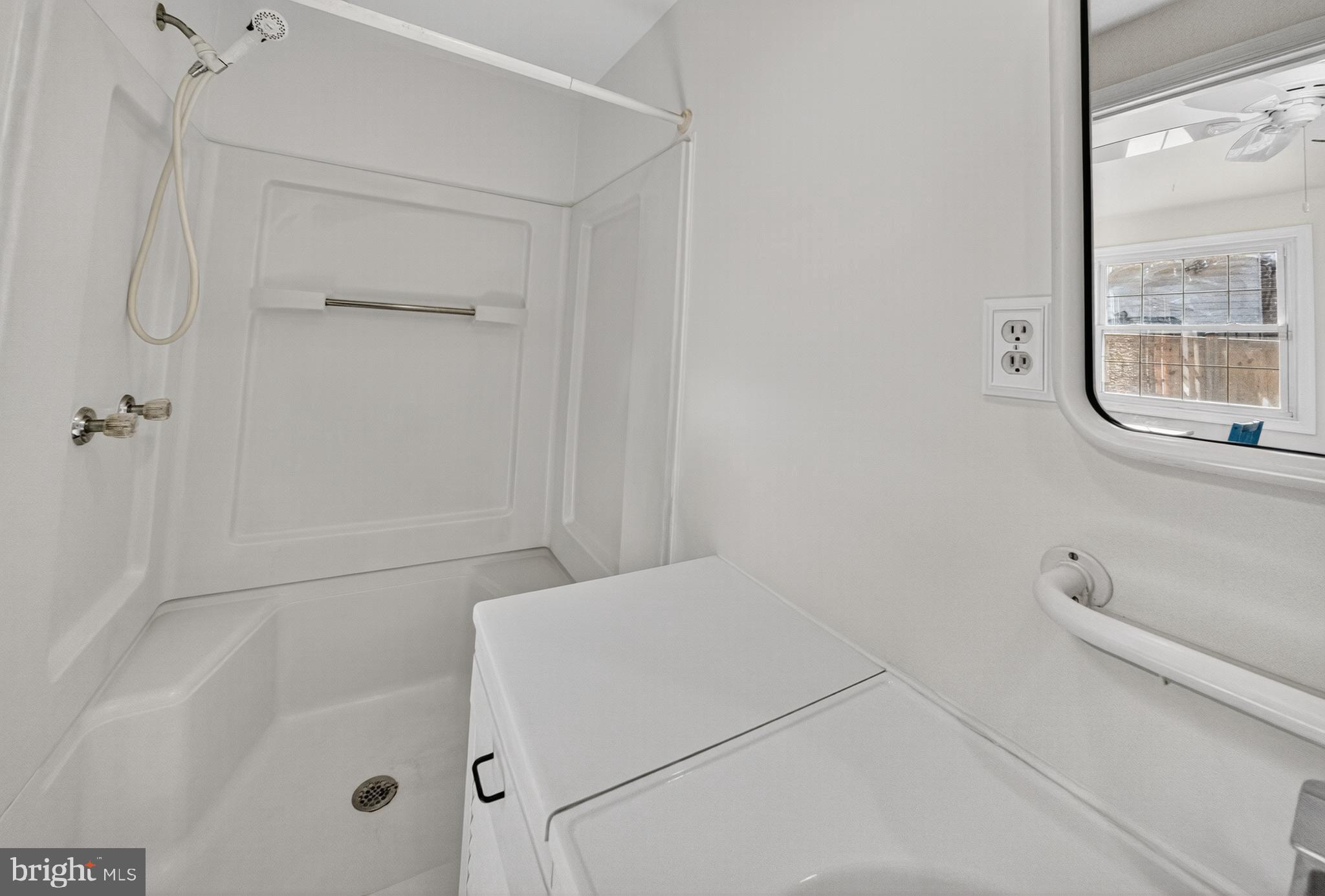 10018 Brookmoor Drive Silver Spring, MD 20901 - Photo 11 of 22 a bathroom with a bathtub and a shower