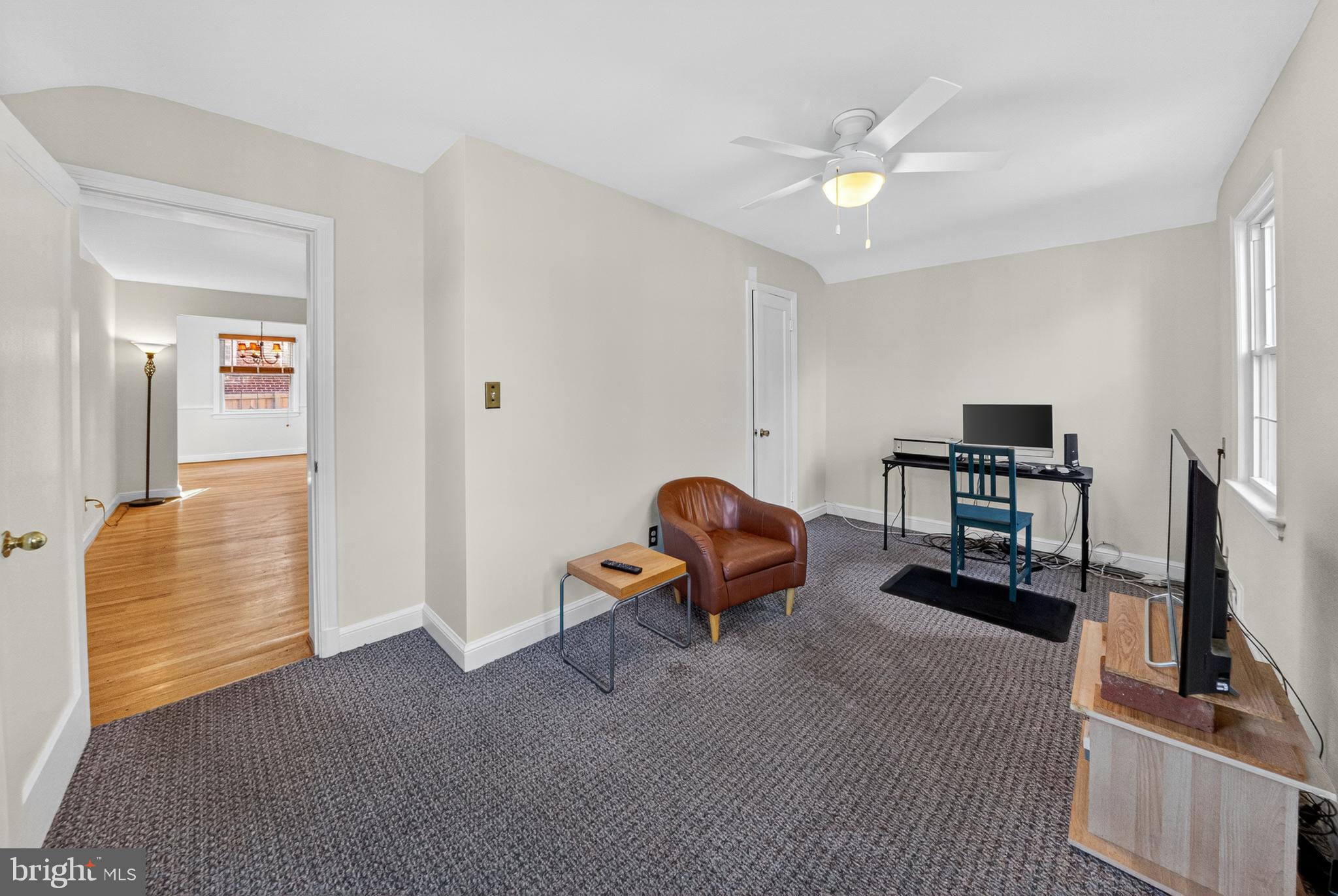 10018 Brookmoor Drive Silver Spring, MD 20901 - Photo 12 of 22 a living room with furniture and a flat screen tv