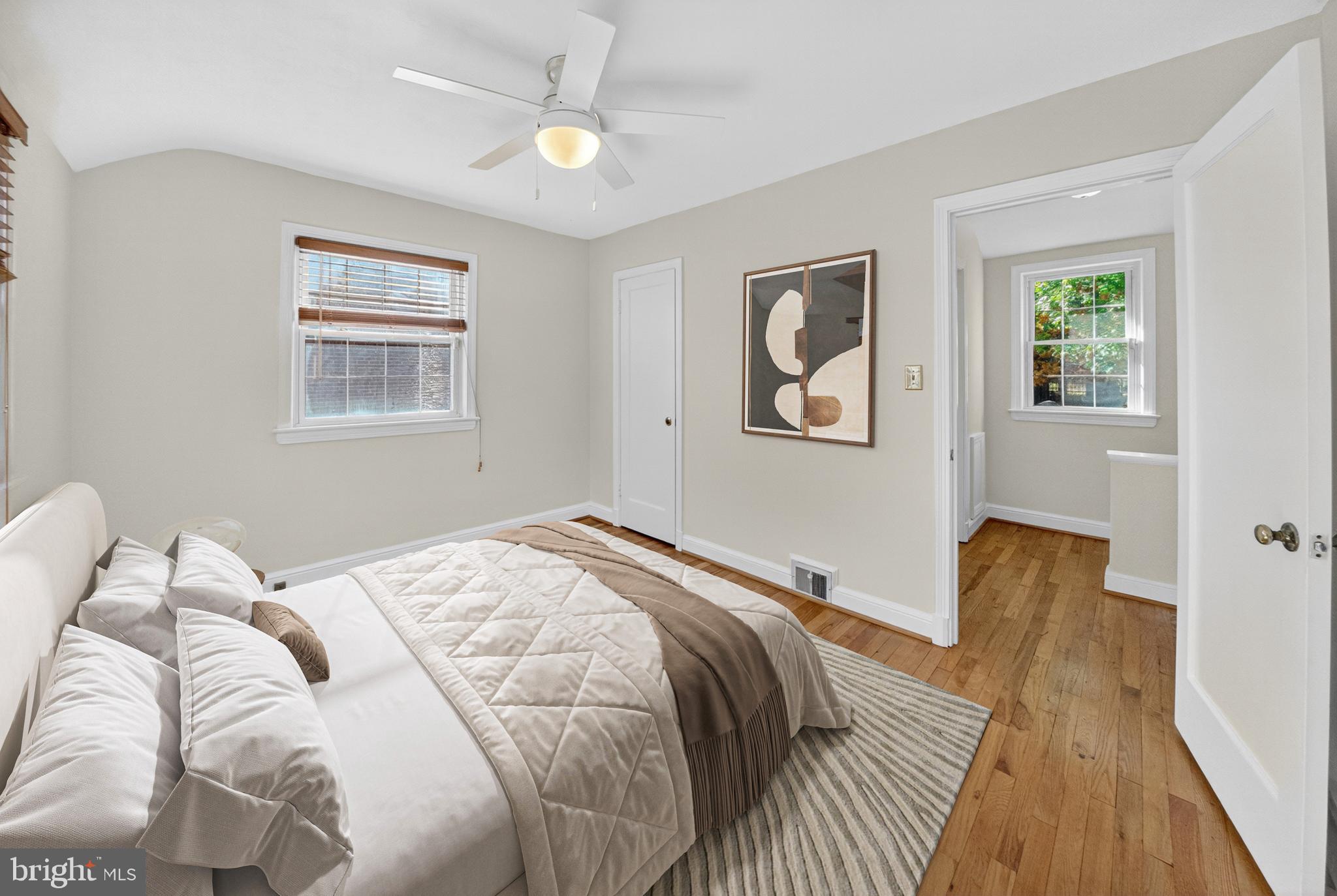 10018 Brookmoor Drive Silver Spring, MD 20901 - Photo 14 of 22 a bed sitting in a bedroom next to a window