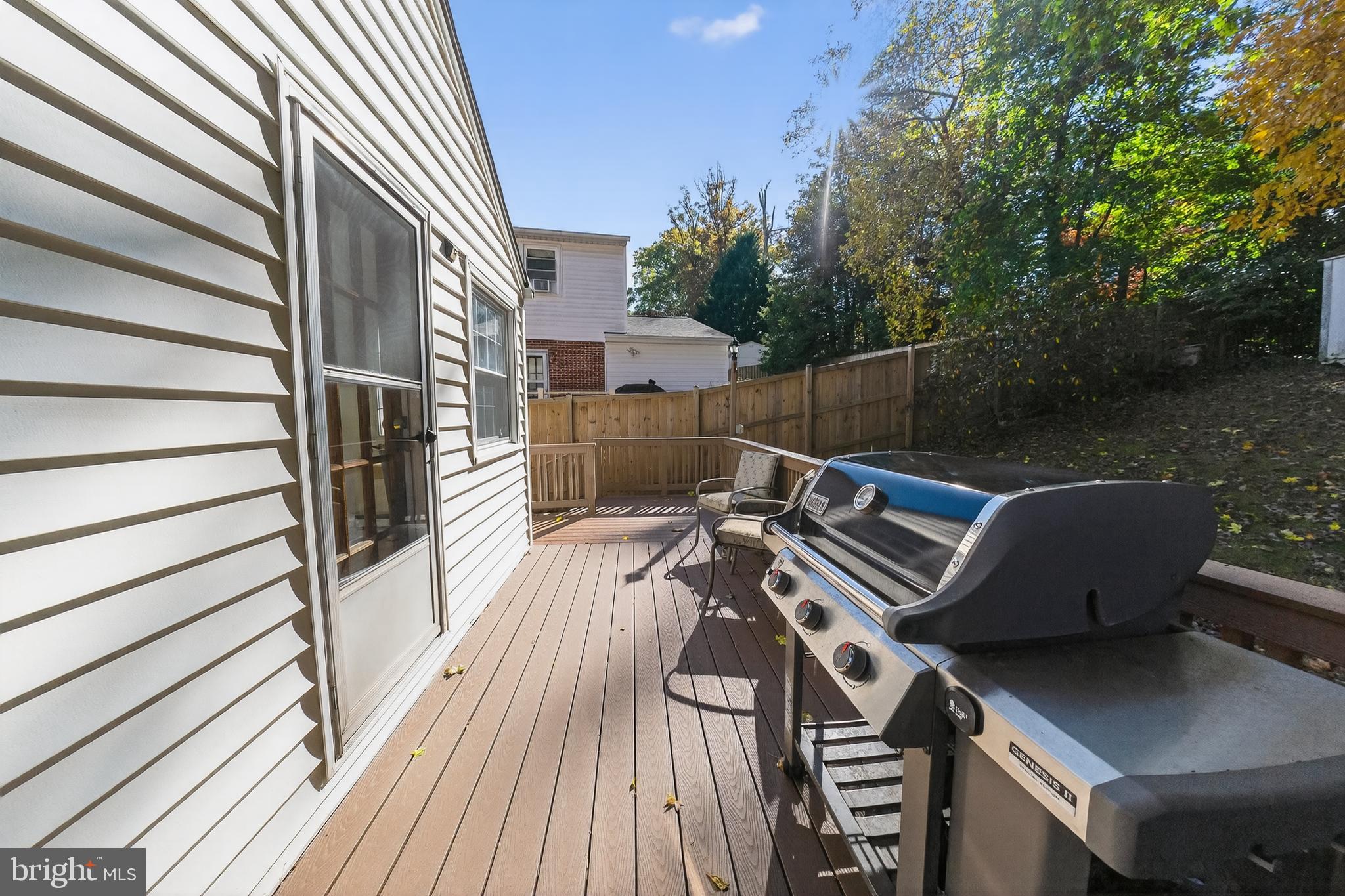 10018 Brookmoor Drive Silver Spring, MD 20901 - Photo 19 of 22 a view of a roof deck with wooden floor and fence