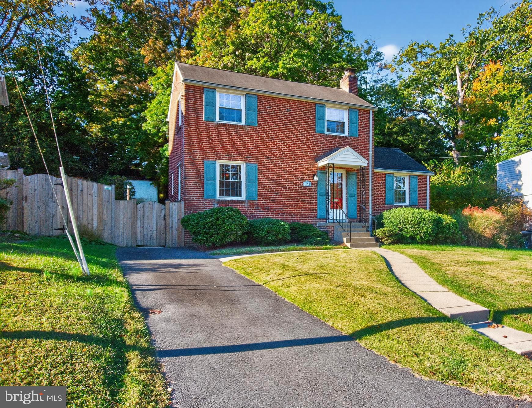 10018 Brookmoor Drive Silver Spring, MD 20901 - Photo 2 of 22 a front view of a house with yard patio and green space