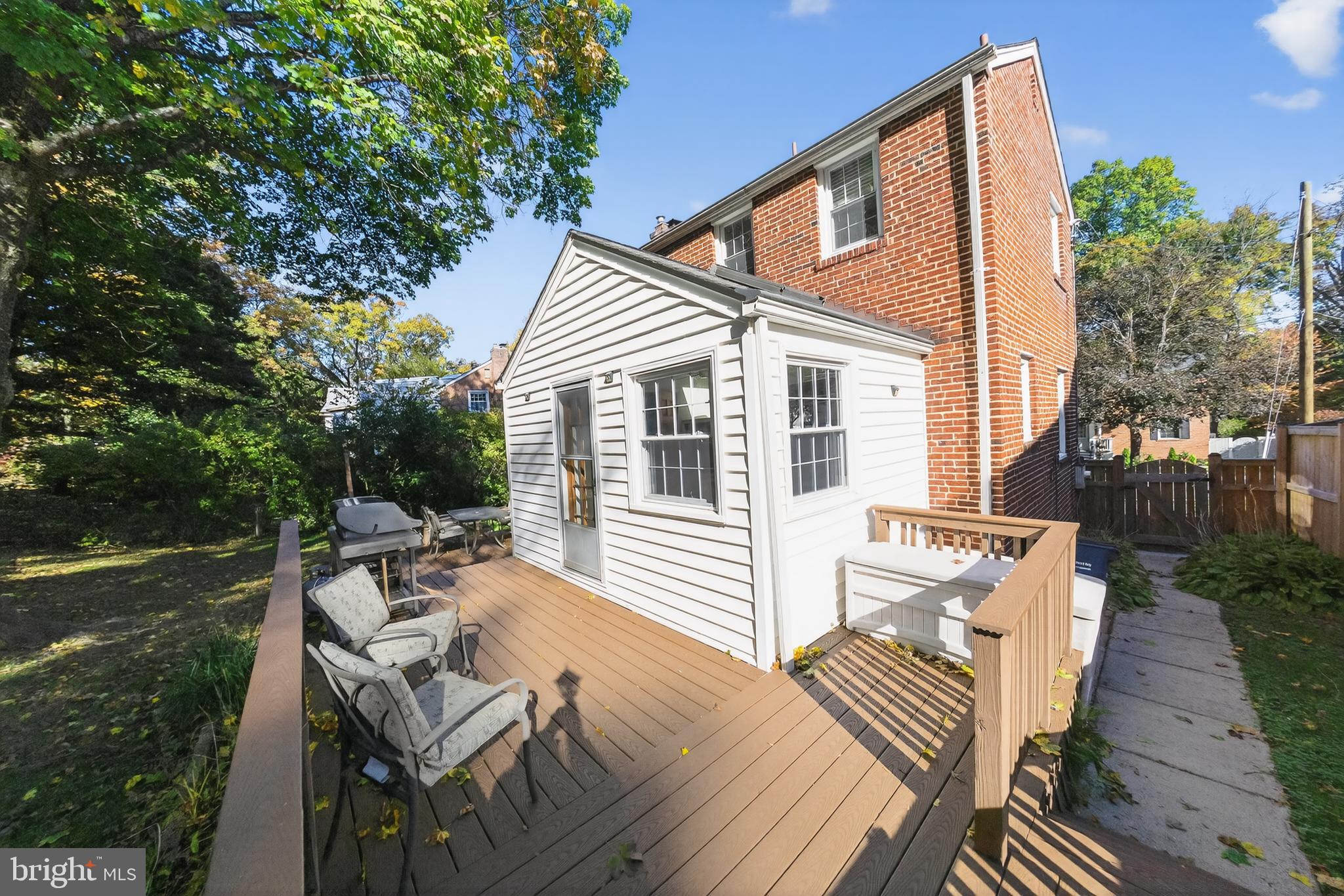 10018 Brookmoor Drive Silver Spring, MD 20901 - Photo 21 of 22 a view of a patio with couches table and chairs and potted plants