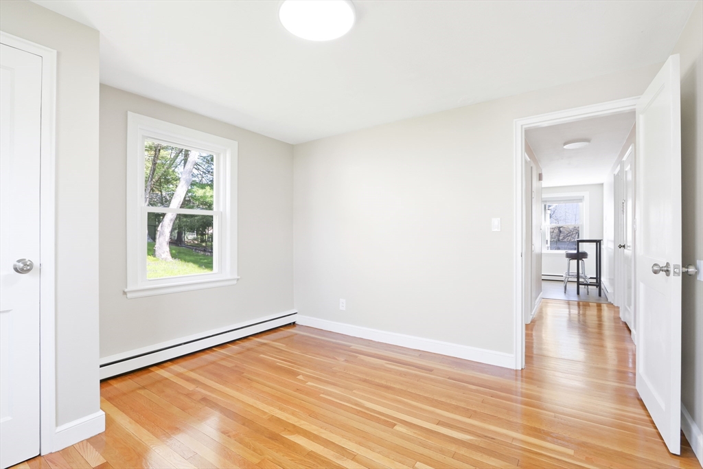 15 Davidson Road Framingham, MA 01701 - Photo 11 of 33 a view of empty room with wooden floor and fan