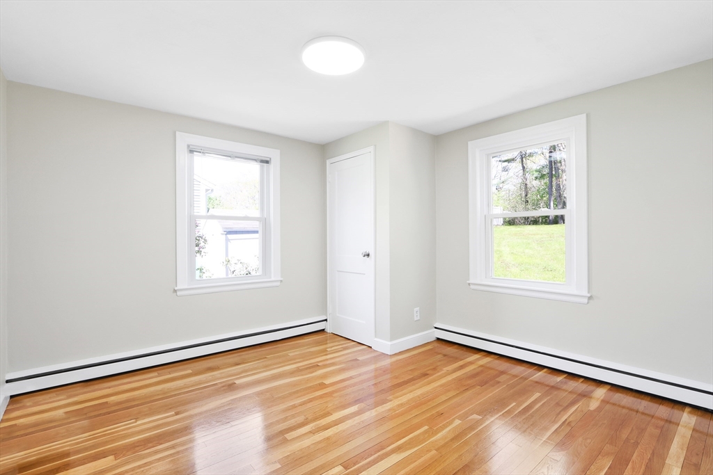 15 Davidson Road Framingham, MA 01701 - Photo 12 of 33 a view of an empty room with wooden floor and a window