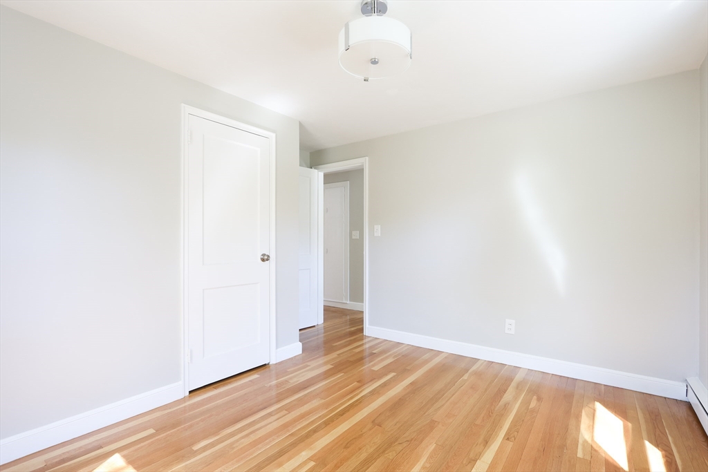 15 Davidson Road Framingham, MA 01701 - Photo 13 of 33 a view of an empty room with wooden floor