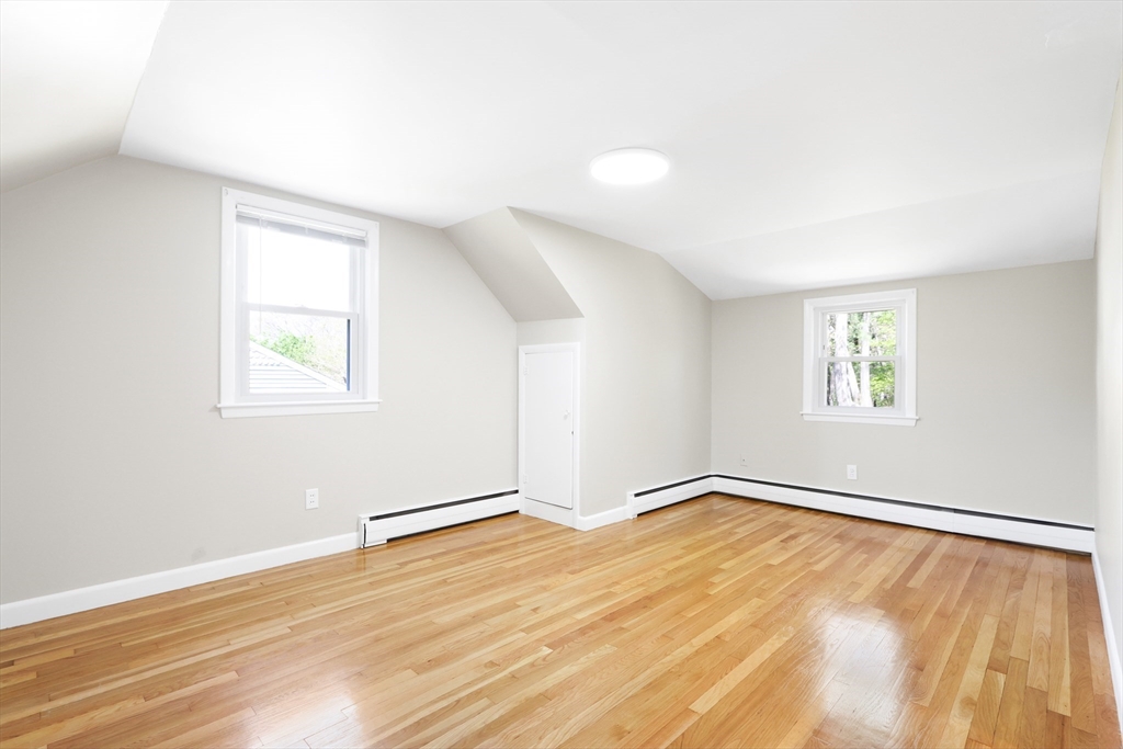 15 Davidson Road Framingham, MA 01701 - Photo 16 of 33 an empty room with wooden floor and windows