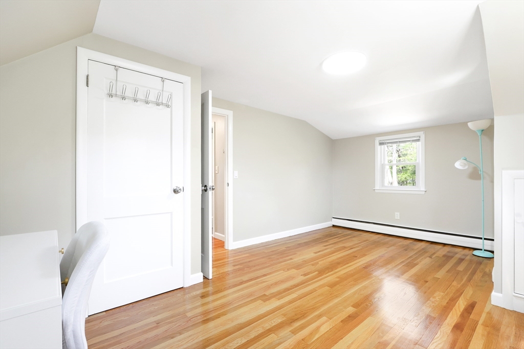 15 Davidson Road Framingham, MA 01701 - Photo 17 of 33 a view of an empty room with wooden floor and a window