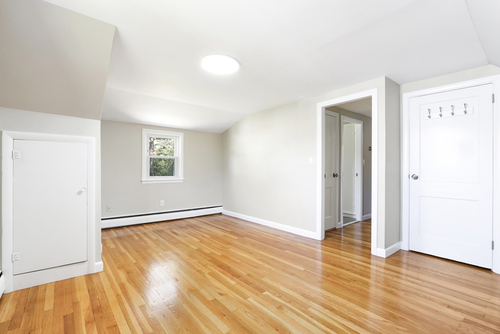 15 Davidson Road Framingham, MA 01701 - Photo 18 of 33 a view of an empty room with wooden floor and a window