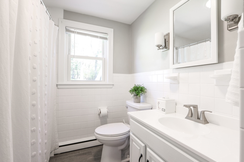 15 Davidson Road Framingham, MA 01701 - Photo 20 of 33 a bathroom with a sink toilet and window