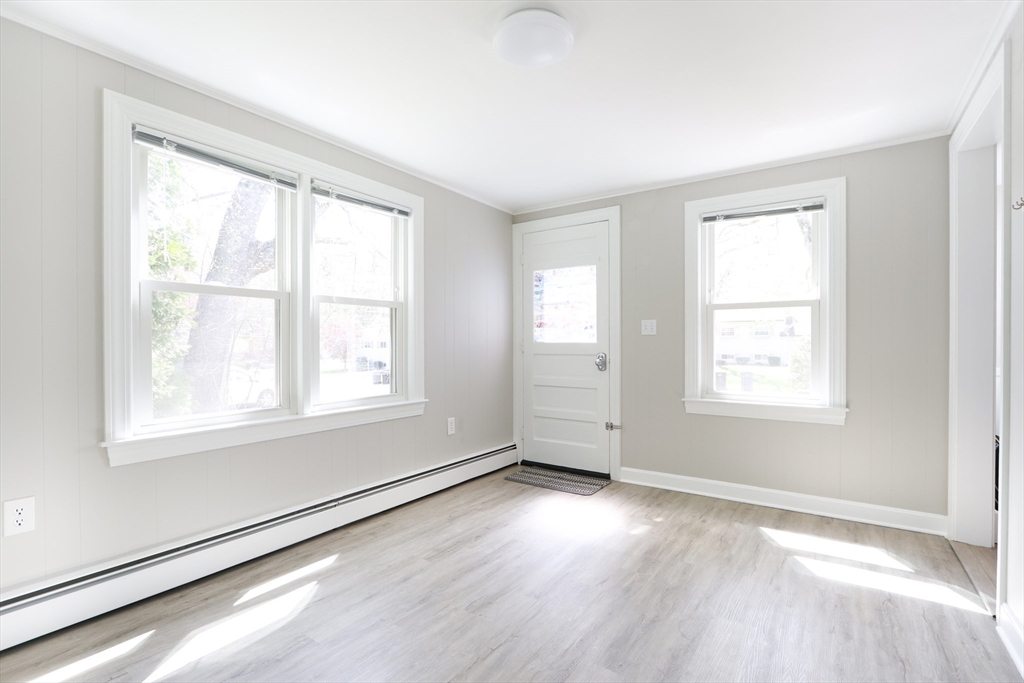 15 Davidson Road Framingham, MA 01701 - Photo 8 of 33 an empty room with wooden floor and windows