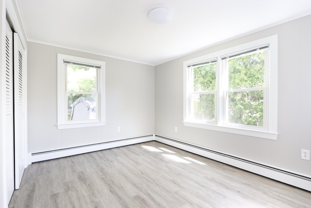 15 Davidson Road Framingham, MA 01701 - Photo 9 of 33 an empty room with wooden floor and windows