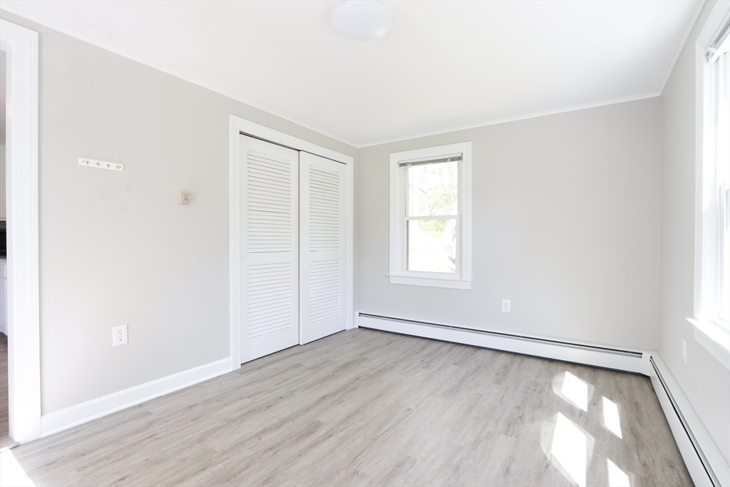 15 Davidson Road Framingham, MA 01701 - Photo 10 of 33 an empty room with wooden floor and windows