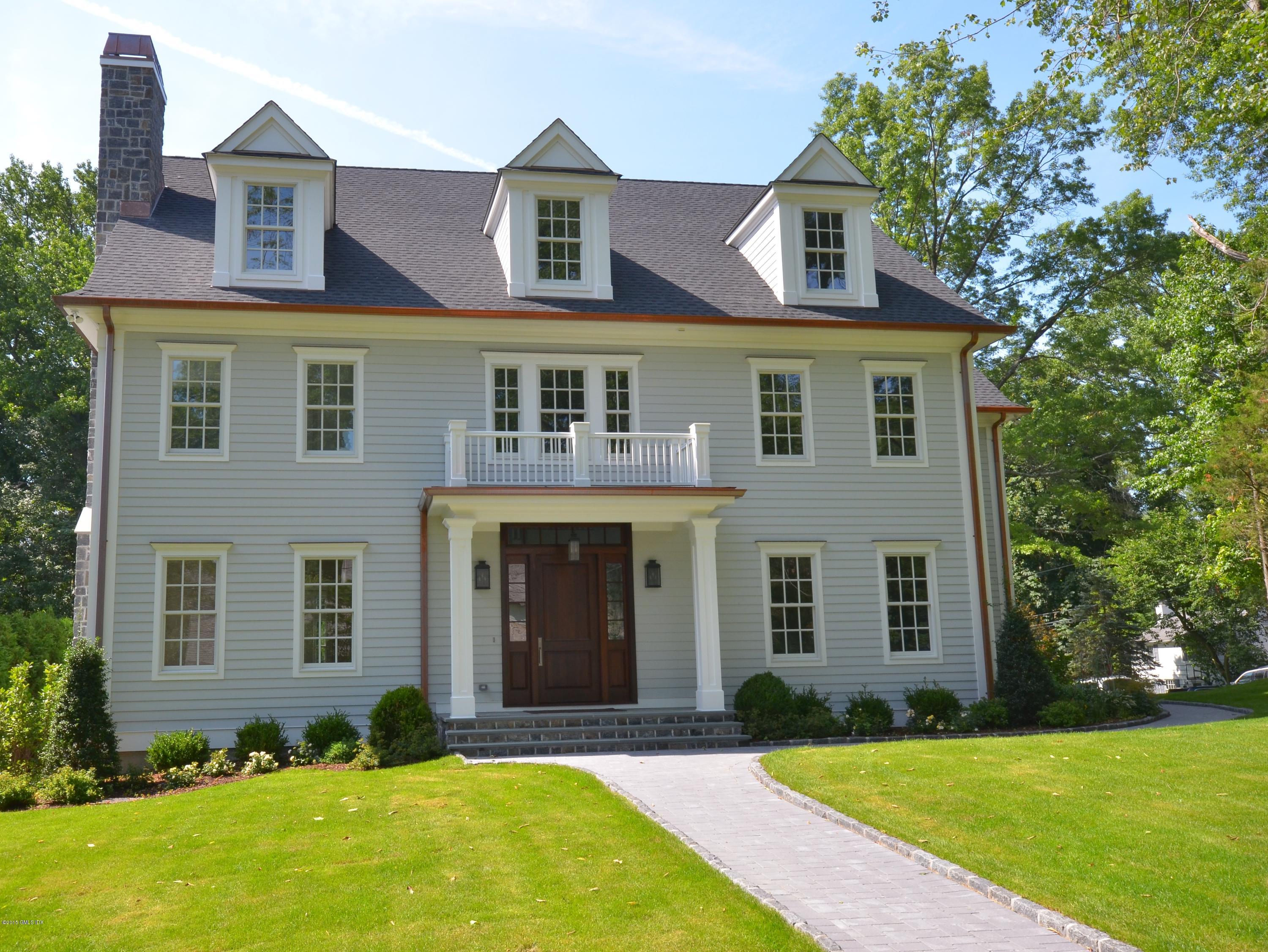 29 Winthrop Drive Riverside, CT 06878 - Photo 1 of 9 a front view of a house with yard and trees