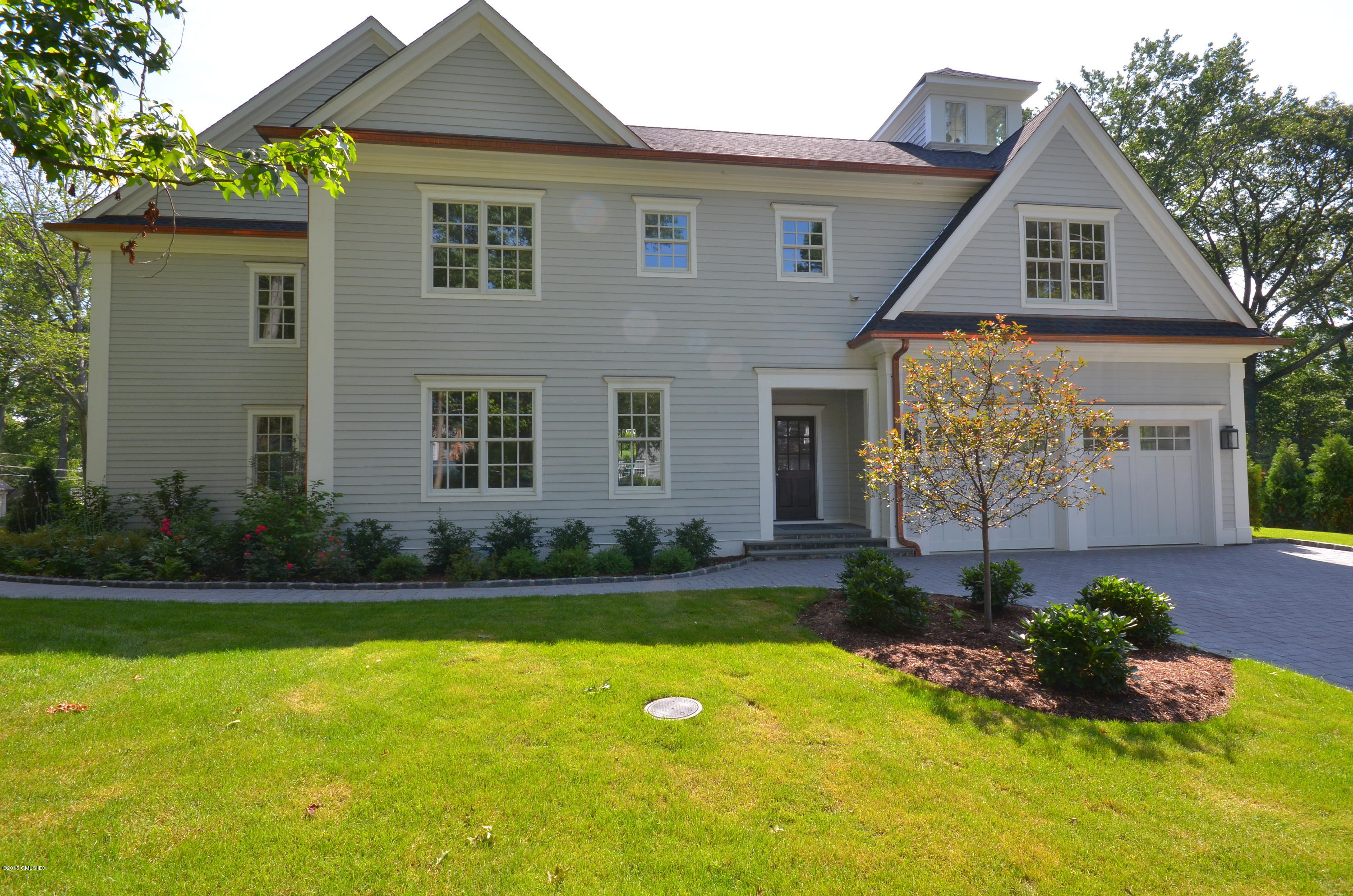 29 Winthrop Drive Riverside, CT 06878 - Photo 2 of 9 a front view of a house with garden