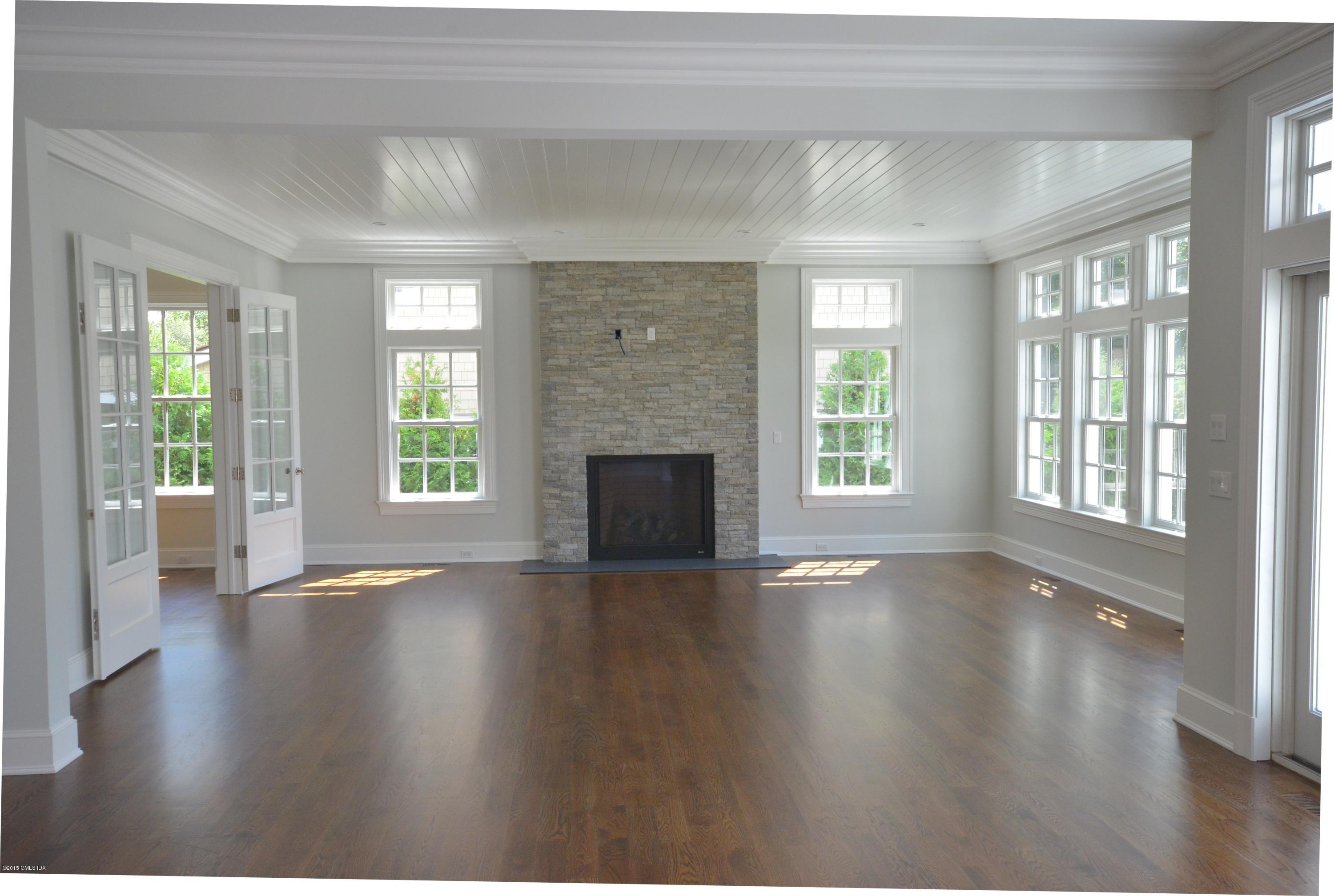 29 Winthrop Drive Riverside, CT 06878 - Photo 5 of 9 an empty room with wooden floor and windows