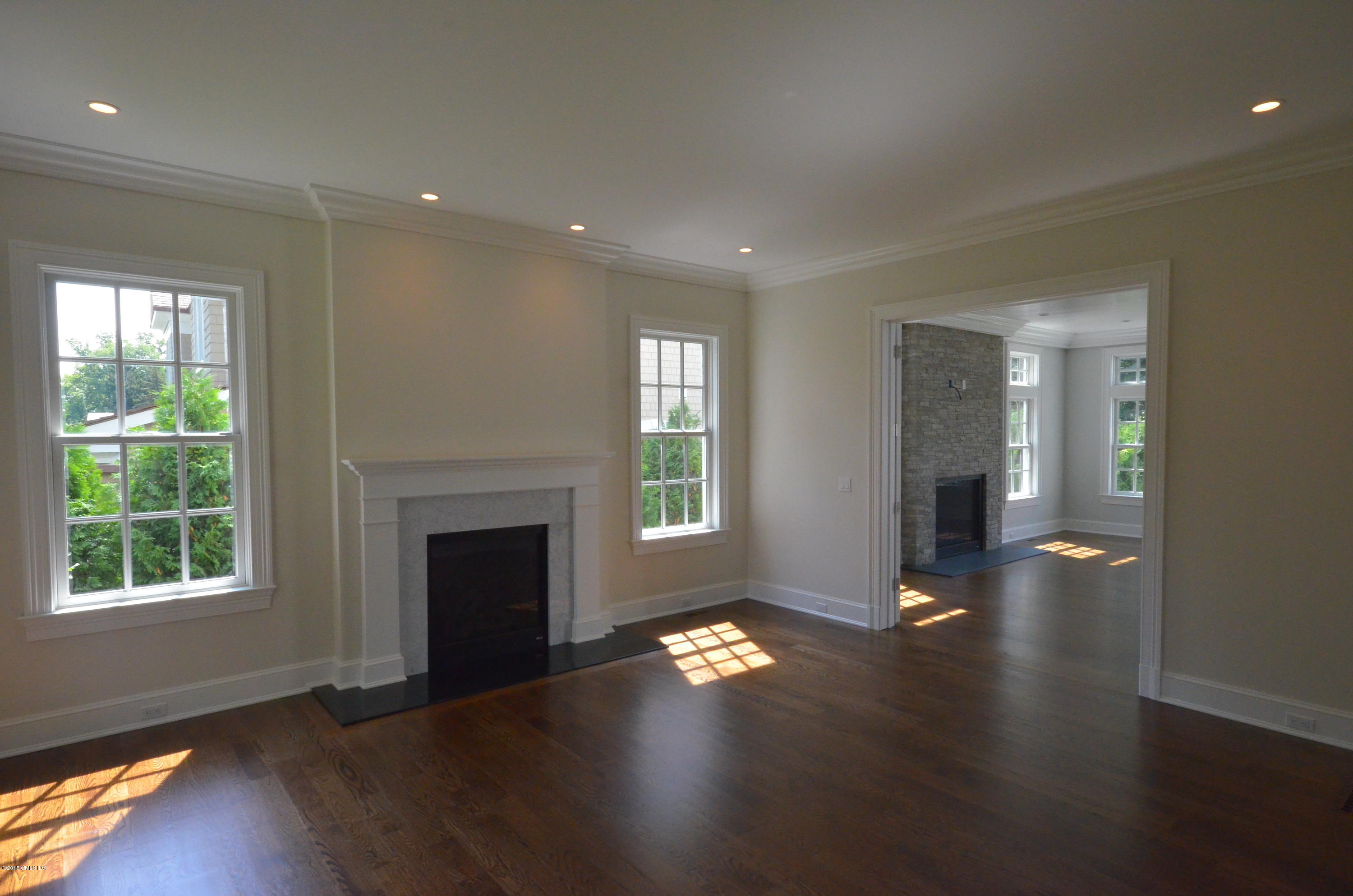29 Winthrop Drive Riverside, CT 06878 - Photo 6 of 9 an empty room with windows and fireplace