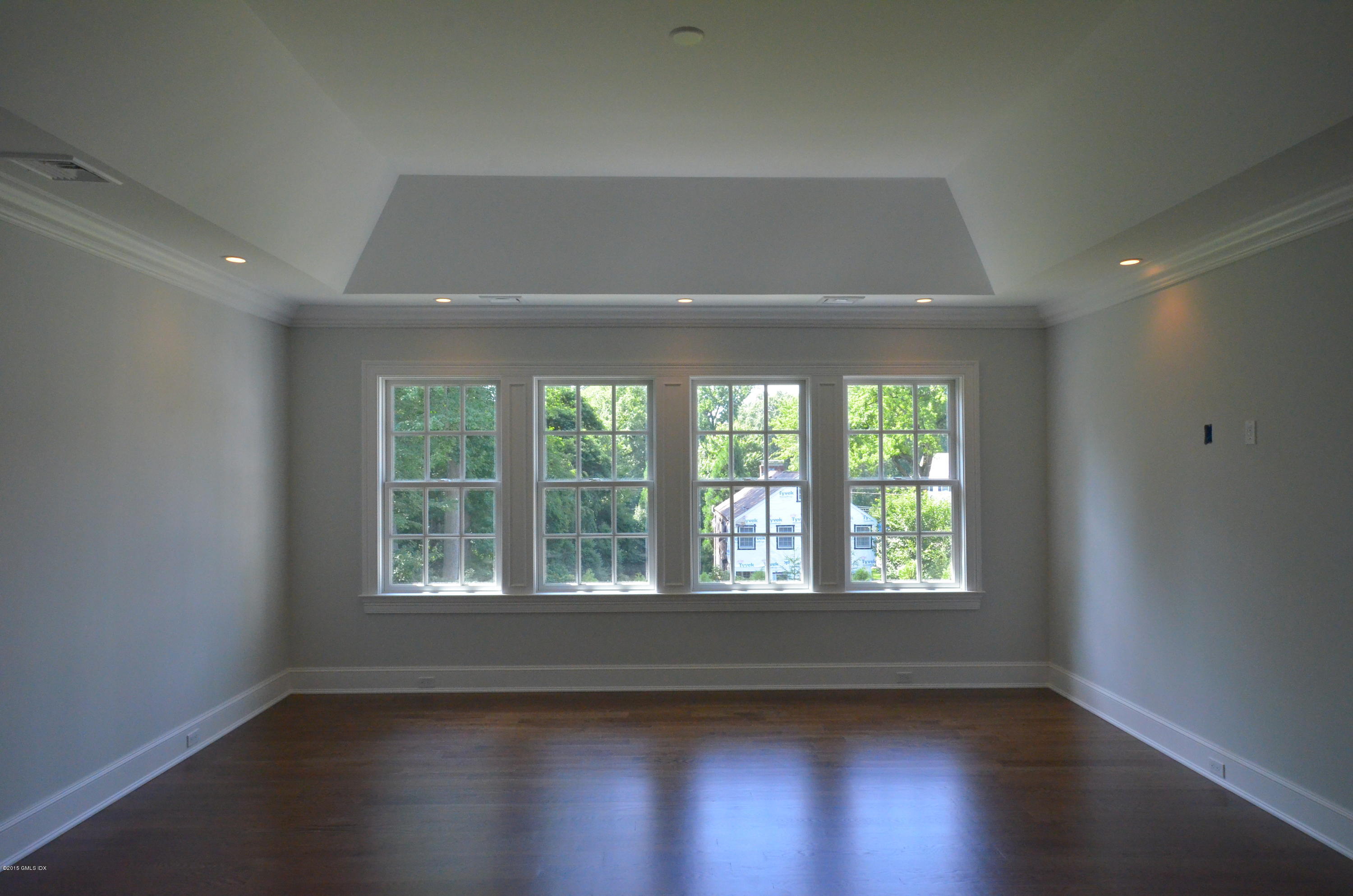 29 Winthrop Drive Riverside, CT 06878 - Photo 7 of 9 an empty room with wooden floor and windows