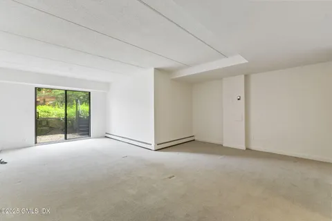 a view of empty room with floor to ceiling window