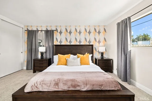 a bedroom with a bed and a window