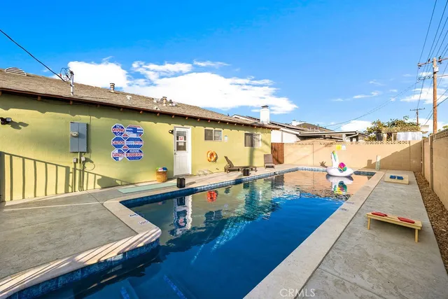 a swimming pool with outdoor seating