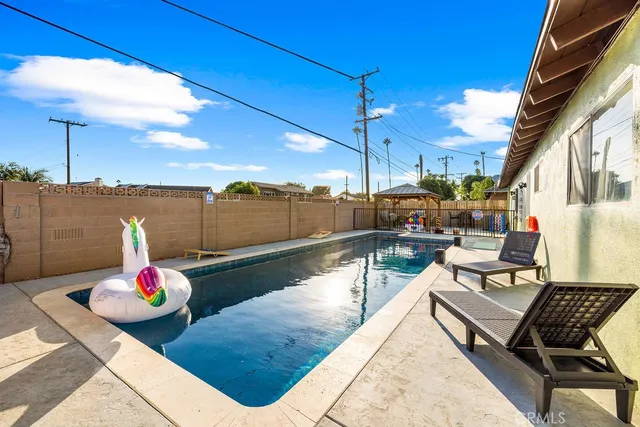 a view of outdoor space with lounge chairs