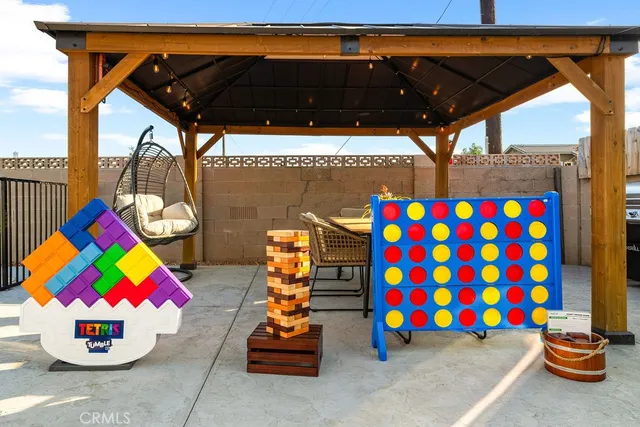 a front view of a house with a yard outdoor seating and garage