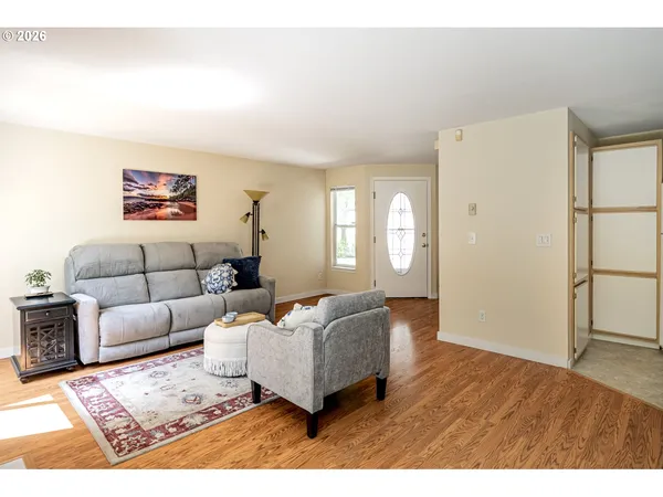 a living room with furniture and a window