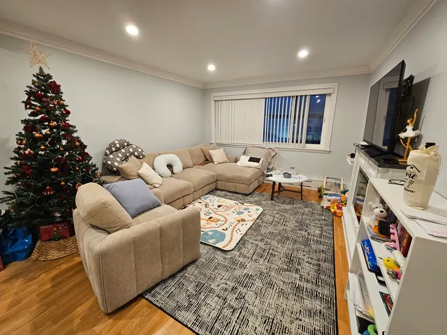 a living room with furniture window and a flat screen tv
