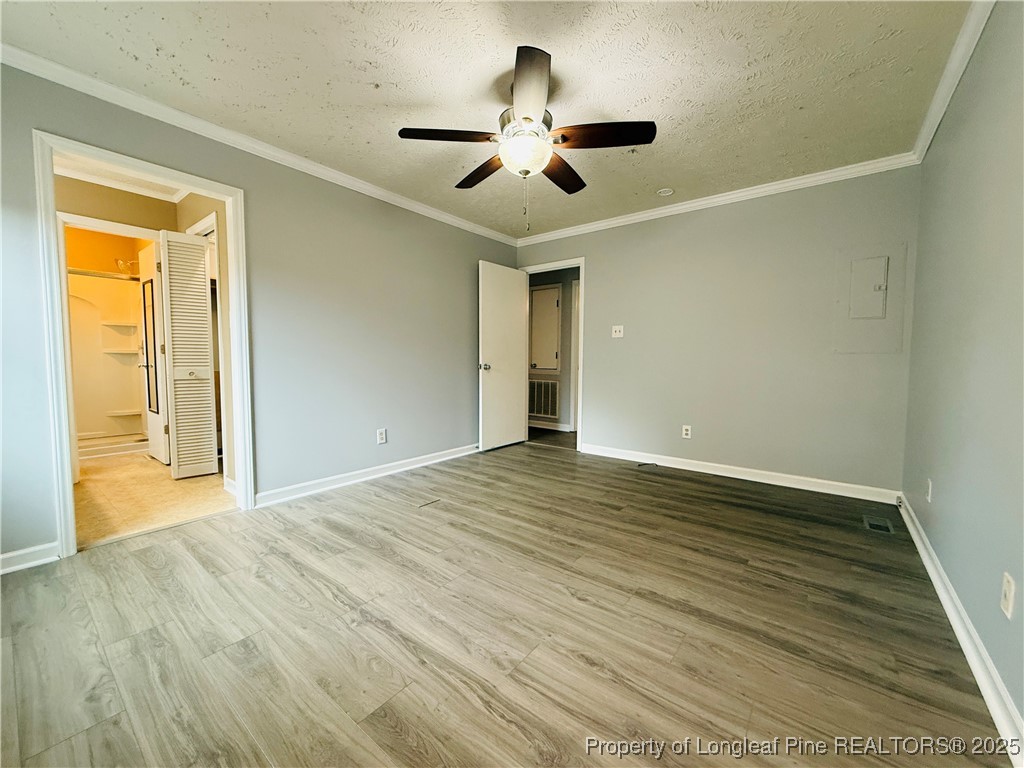 5901 Rehoboth Road Hope Mills, NC 28348 - Photo 11 of 22 a view of an empty room with wooden floor and a window